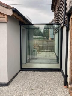 In conclusion, a frameless glass link offers more than a physical connection between spaces. It creates continuity, introduces natural light, and maintains a clear architectural distinction between old and new.By removing heavy framing and visible structure, the focus remains on the surrounding materials and landscape. The result is a clean, understated transition that feels considered rather than imposed.For period renovations, contemporary extensions, or complex linking structures, a bespoke frameless glass link provides clarity, lightness and design flexibility where standard systems often fall short.If you are exploring how to connect two structures without compromising character or light, a thoughtfully designed glass link is often the most refined solution.Our next focus will be on oversized double glazing, rooflights and walk-on glass!#GlassLink #FramelessGlass #StructuralGlazing #ArchitecturalGlass #LuxuryHomes ContemporaryArchitecture DesignDetail GlazedExtension BespokeDesign HighEndHomes
