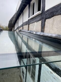 How does a glass to glass joint look on a frameless glass link?It is a detail we are often asked about during the design stage.In most frameless glass links, the panes are joined using structural silicone to create a slim, consistent bond line. When combined with stepped edges and silicone backpainting, the joint reads as a fine shadow line rather than a visible seam. The result is clean and visually quiet, allowing the transparency of the link to remain the focus.From inside, the junction appears subtle and uniform. From outside, reflections across the glazing further soften the line, particularly when pane sizes and setting out have been carefully considered.These details may seem simple, but achieving a refined finish requires careful coordination, precise fabrication and experienced installation.If you are developing a glass link and would like to review joint detailing at concept stage, we are happy to discuss practical solutions that support both design intent and buildability.#architects #architecturalglass #fractlessdesign #glasslink #structuralglazing framelessglass detaildesign highendresidential commercialarchitecture glazingspecialist