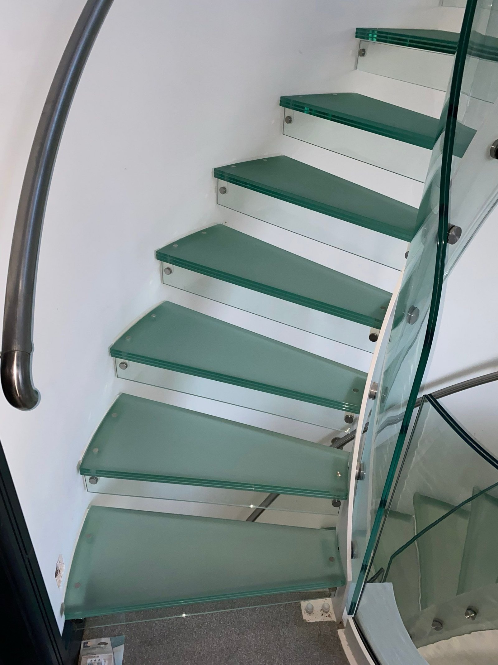 Internal walk-on glass panels can completely transform how light moves through a home.In this project, a structural glass floor panel by the treads to bring natural light down into the lower level. The result is a brighter, more connected space without increasing the building footprint.Each panel is designed to suit the specific opening, structural requirements and finished floor build-up. Loadings, slip resistance, glass specification and edge detailing all need to be resolved precisely to achieve both performance and a clean, flush finish.Bespoke glass solutions where detail and coordination matter.#walkonglass #glassfloor #structuralglass #architecturalglazing #framelessglass luxuryhomes bespokedesign staircasedesign interiordesignuk glasspanel highendhomes precisionglass